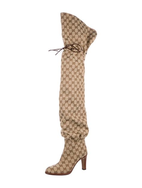 gucci monogram thigh high boots.